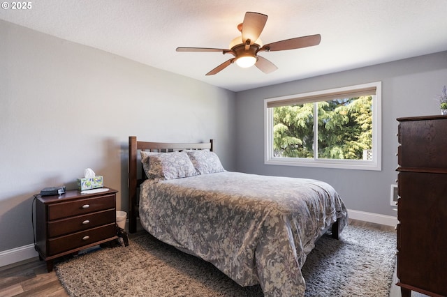 29460 SW Volley St Unit 72, Wilsonville, OR 97070 - bedroom featuring baseboards, a ceiling fan, and wood finished floors