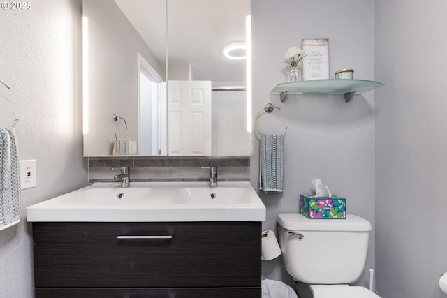29460 SW Volley St Unit 72, Wilsonville, OR 97070 - bathroom with double vanity, a sink, a shower with shower door, and toilet