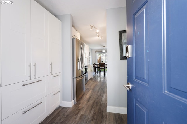 29460 SW Volley St Unit 72, Wilsonville, OR 97070 - foyer entrance featuring baseboards, a ceiling fan, dark wood-style flooring, and rail lighting