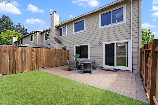 29460 SW Volley St Unit 72, Wilsonville, OR 97070 - back of property with outdoor lounge area, fence, a chimney, a patio area, and a yard