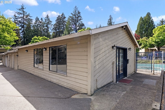 29460 SW Volley St Unit 72, Wilsonville, OR 97070 - view of outdoor structure with fence and a fenced in pool