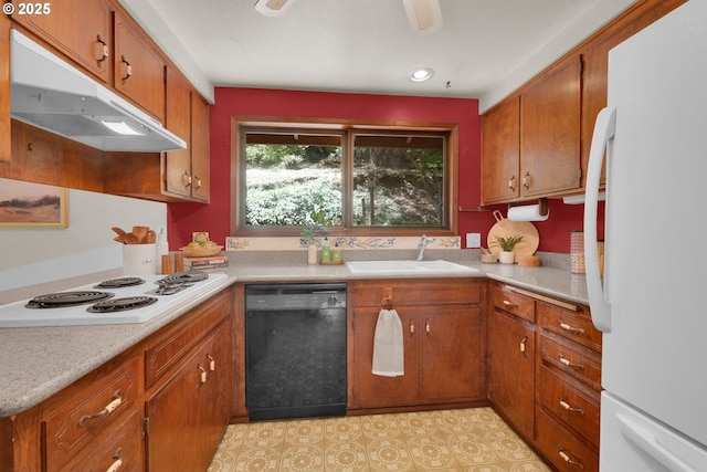 1770 W 28th Ave, Eugene, OR 97405 - kitchen featuring white appliances, under cabinet range hood, brown cabinetry, light countertops, and recessed lighting