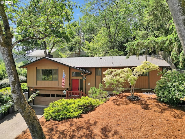 1770 W 28th Ave, Eugene, OR 97405 - split foyer home with an attached garage, concrete driveway, and a shingled roof