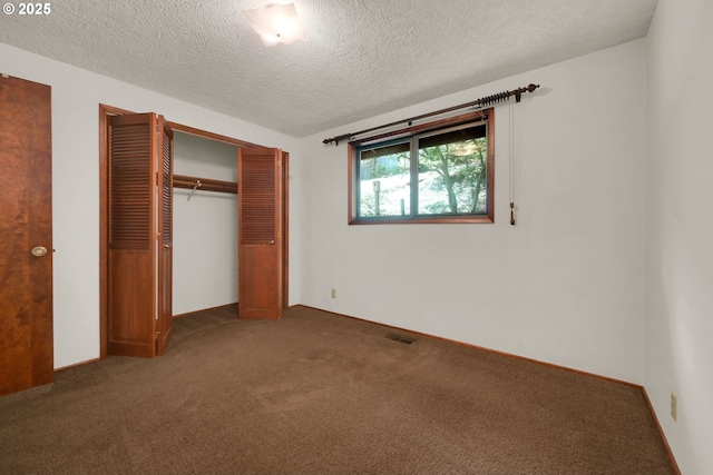 1770 W 28th Ave, Eugene, OR 97405 - unfurnished bedroom featuring carpet floors, a closet, and a textured ceiling
