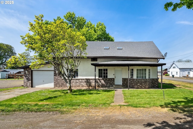 view of front facade with a front yard, a garage, brick siding, concrete driveway, and stucco siding