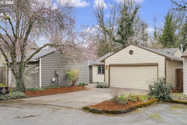 view of front of home with an attached garage and driveway