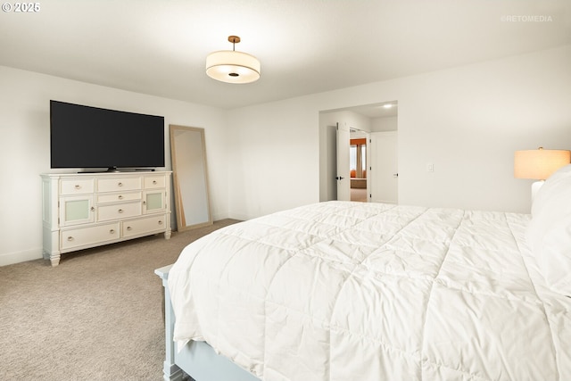 carpeted bedroom featuring baseboards