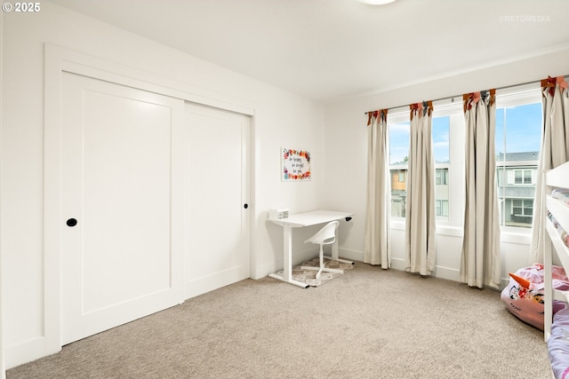 unfurnished bedroom featuring a closet and carpet floors