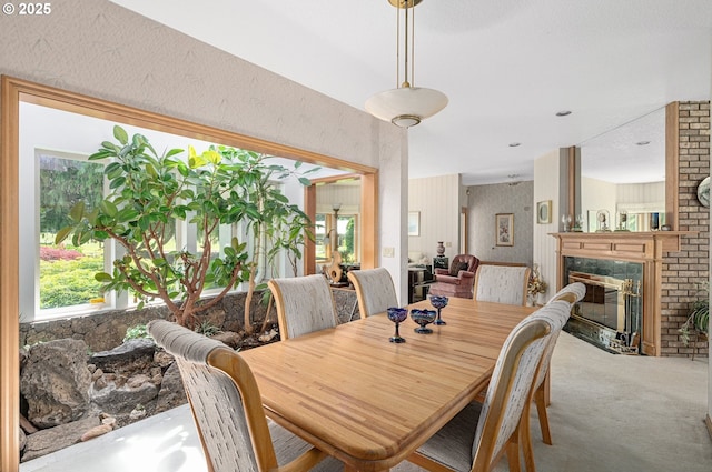 22750 SW Rosedale Rd, Beaverton, OR 97078 - dining area with carpet floors and a fireplace with flush hearth