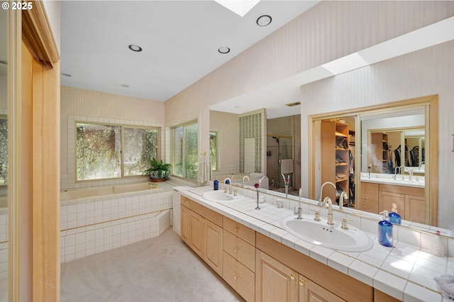 22750 SW Rosedale Rd, Beaverton, OR 97078 - full bath with a skylight, double vanity, a shower stall, a spacious closet, and a bath