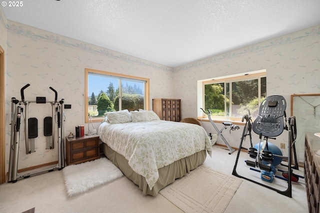 22750 SW Rosedale Rd, Beaverton, OR 97078 - bedroom with wallpapered walls, multiple windows, light colored carpet, and a textured ceiling