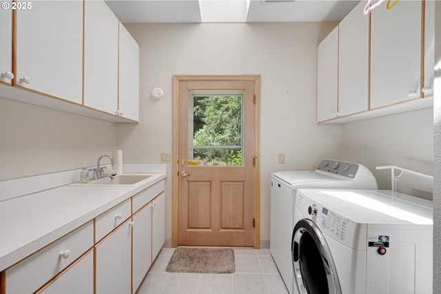 22750 SW Rosedale Rd, Beaverton, OR 97078 - laundry area with cabinet space, washer and dryer, and light tile patterned floors