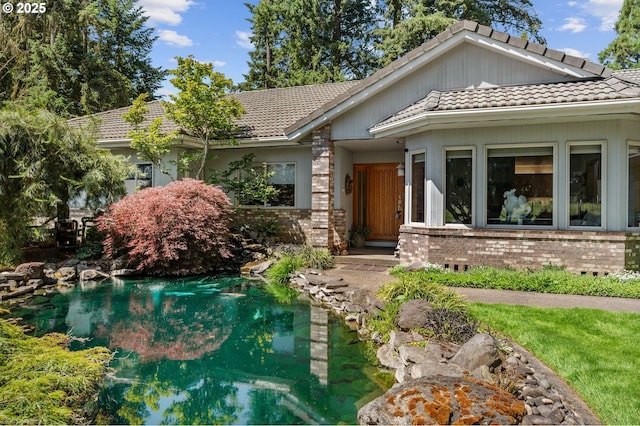 22750 SW Rosedale Rd, Beaverton, OR 97078 - view of front of house featuring a tiled roof and brick siding