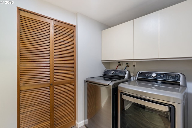 laundry room featuring cabinet space and washing machine and clothes dryer