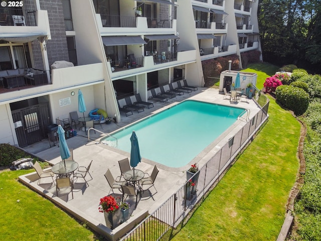 community pool with a patio area