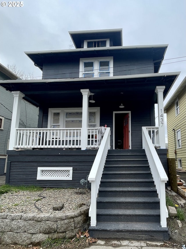 view of front facade featuring stairway and covered porch