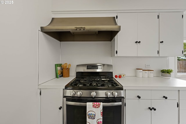 904 NE 78th Ave, Portland, OR 97213 - kitchen with gas range, light countertops, and white cabinetry