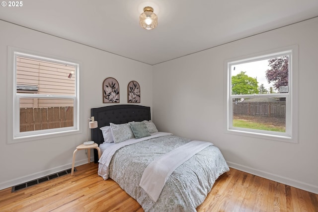 904 NE 78th Ave, Portland, OR 97213 - bedroom with baseboards and wood finished floors