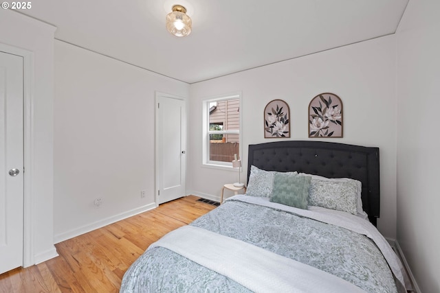 904 NE 78th Ave, Portland, OR 97213 - bedroom with baseboards and wood finished floors