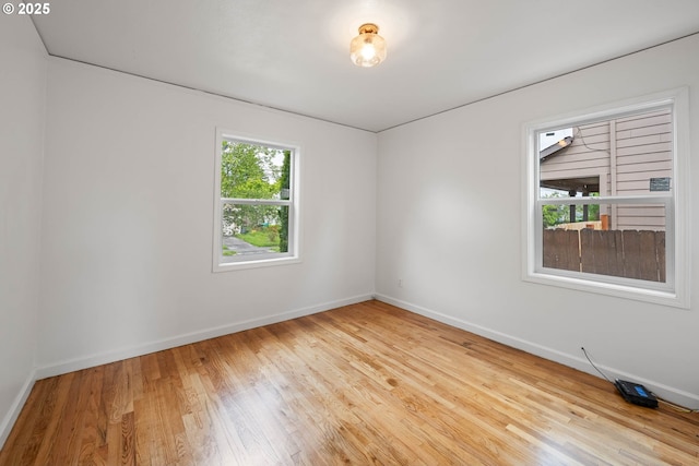 904 NE 78th Ave, Portland, OR 97213 - unfurnished room with baseboards and wood finished floors