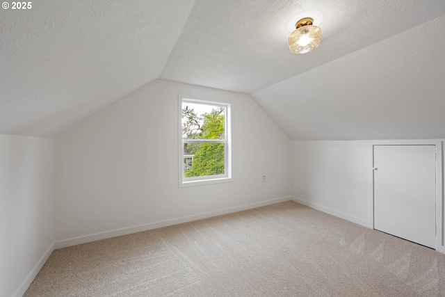 904 NE 78th Ave, Portland, OR 97213 - additional living space featuring carpet, a textured ceiling, baseboards, and vaulted ceiling