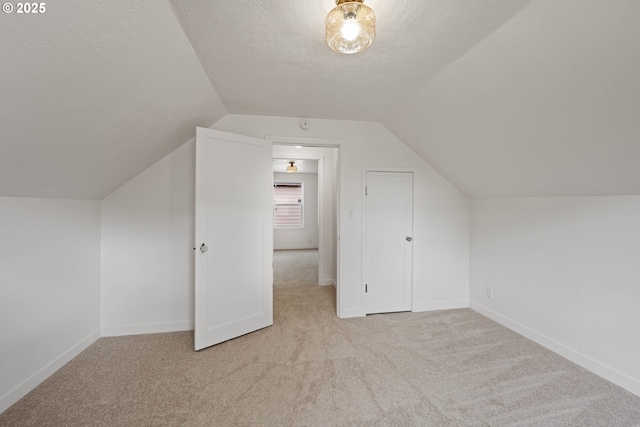 904 NE 78th Ave, Portland, OR 97213 - bonus room with carpet flooring, lofted ceiling, a textured ceiling, and baseboards
