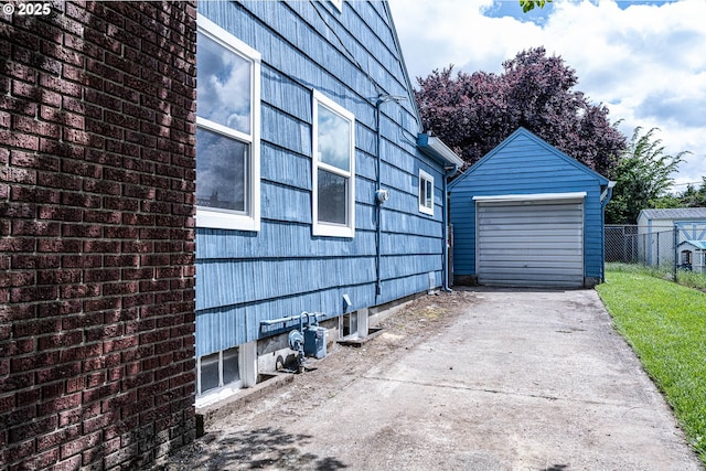 904 NE 78th Ave, Portland, OR 97213 - view of home's exterior featuring driveway, a garage, and an outbuilding
