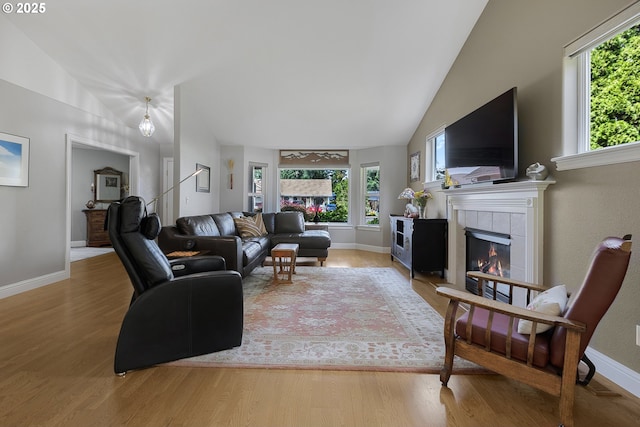 1575 Fairview Pl, Cottage Grove, OR 97424 - living room featuring plenty of natural light, wood finished floors, a tile fireplace, and vaulted ceiling