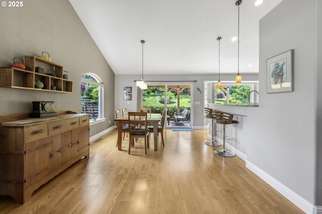1575 Fairview Pl, Cottage Grove, OR 97424 - dining space with light wood-type flooring, plenty of natural light, and high vaulted ceiling