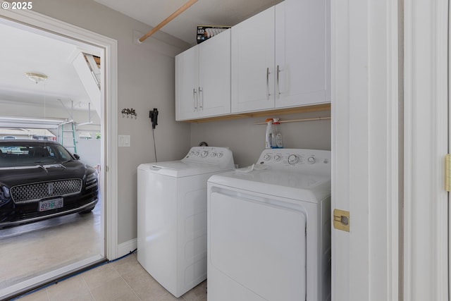 1575 Fairview Pl, Cottage Grove, OR 97424 - washroom with cabinet space, washing machine and dryer, and light tile patterned floors