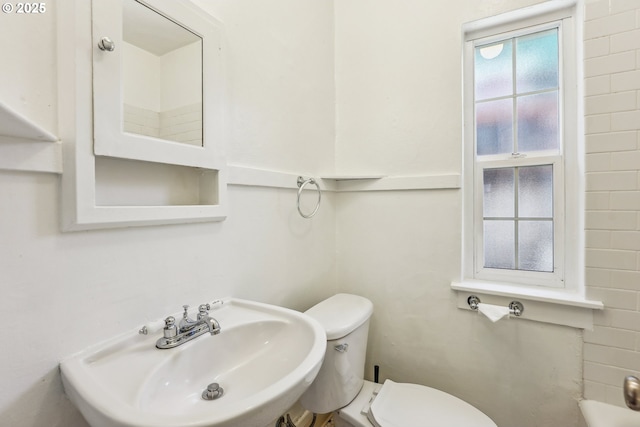 bathroom featuring toilet and sink