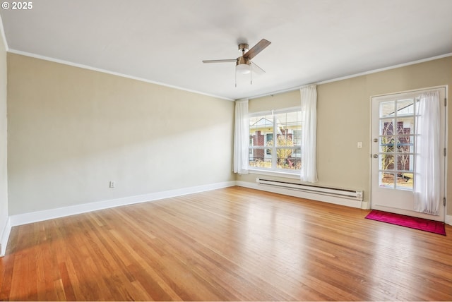 unfurnished room featuring hardwood / wood-style floors, plenty of natural light, ceiling fan, and a baseboard heating unit