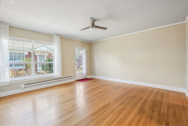 empty room featuring ceiling fan, light wood-type flooring, crown molding, and a baseboard radiator