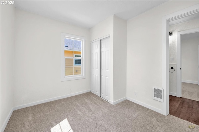 3114 Delaware St, Longview, WA 98632 - unfurnished bedroom featuring carpet floors, baseboards, visible vents, and a closet