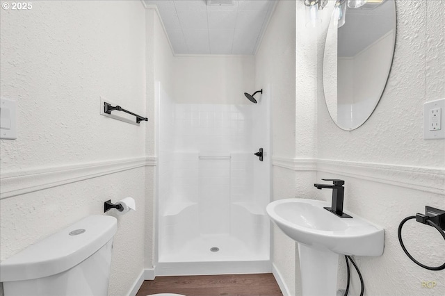 3114 Delaware St, Longview, WA 98632 - full bath featuring toilet, a textured wall, a shower stall, and wood finished floors