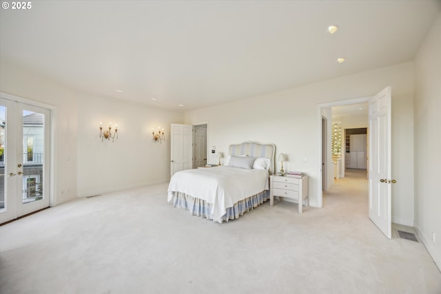 bedroom featuring light carpet, access to exterior, and french doors