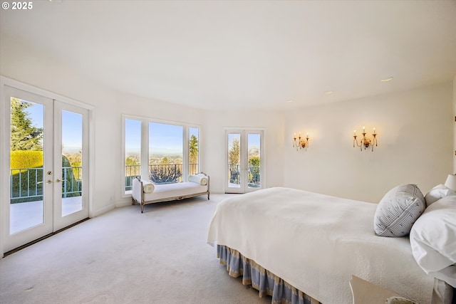 bedroom with french doors, access to exterior, and multiple windows