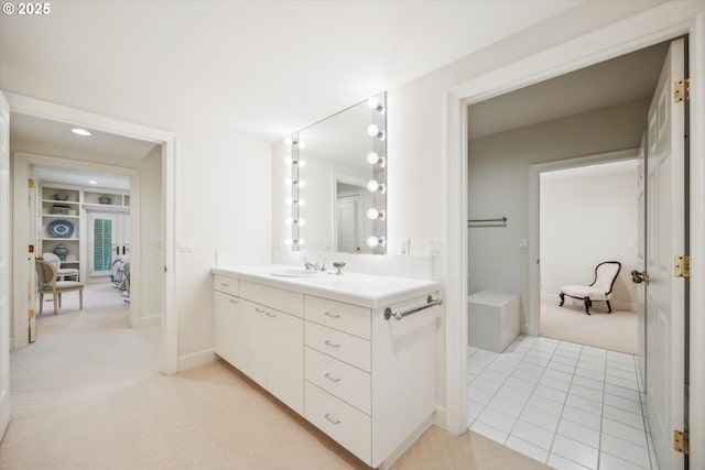 bathroom with tile patterned flooring and vanity