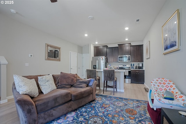 7110 NE 155th Pl, Vancouver, WA 98682 - living room with recessed lighting, light wood-type flooring, visible vents, and baseboards
