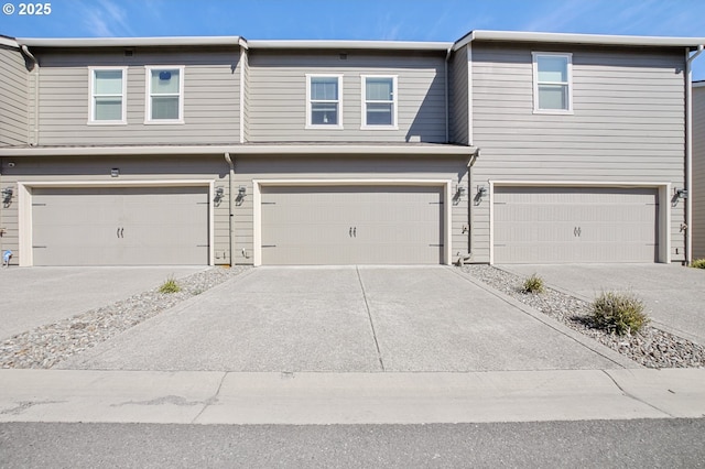 7110 NE 155th Pl, Vancouver, WA 98682 - view of property with concrete driveway and a garage