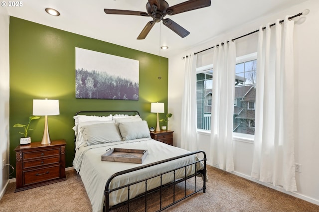 carpeted bedroom with ceiling fan