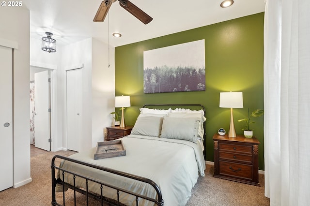 carpeted bedroom with ceiling fan