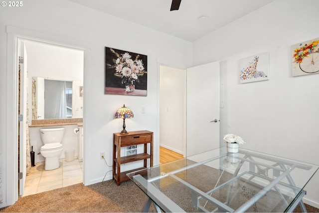 interior space featuring ceiling fan