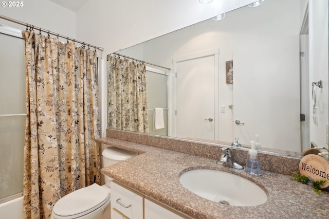 full bathroom featuring vanity, shower / tub combo with curtain, and toilet