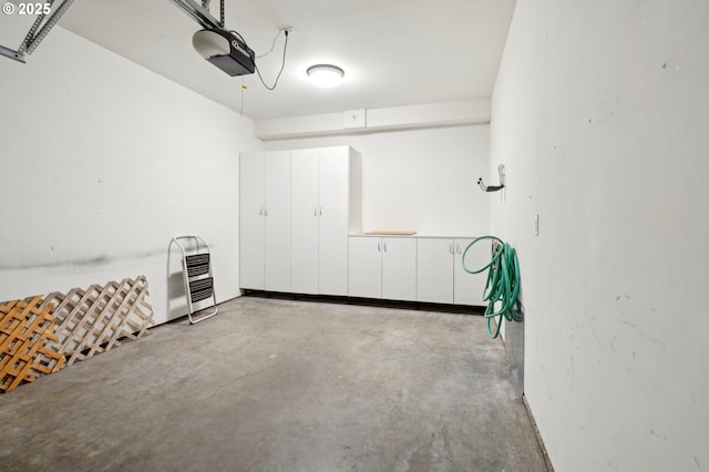 garage featuring a garage door opener and heating unit