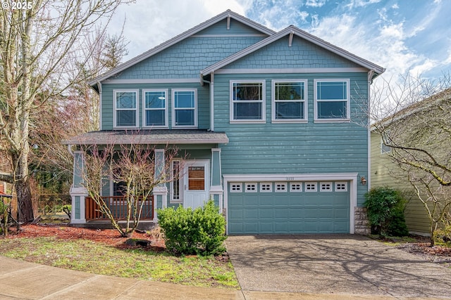 craftsman inspired home featuring concrete driveway, a porch, and an attached garage