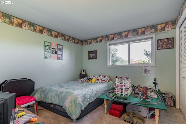 bedroom featuring a closet and carpet floors