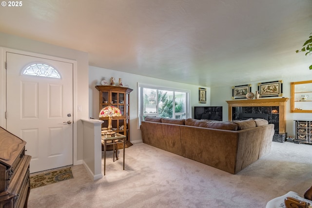 carpeted living room featuring a premium fireplace