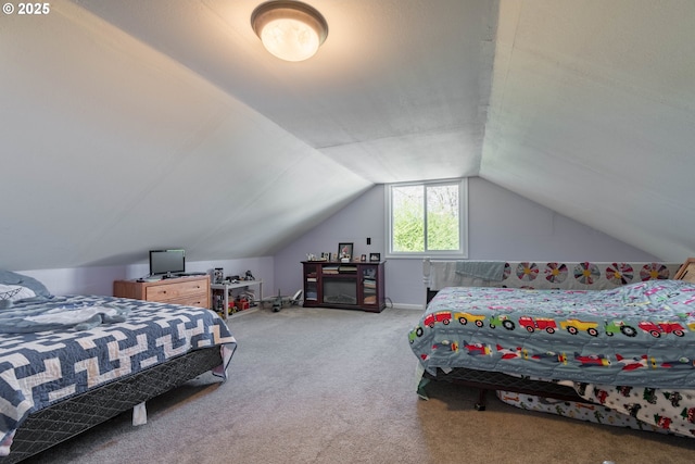 bedroom featuring carpet flooring and vaulted ceiling