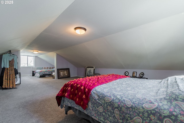 carpeted bedroom featuring vaulted ceiling